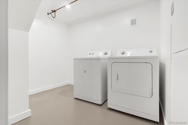 3739 W 46th Ave, Denver, CO 80211 - laundry area featuring separate washer and dryer and baseboards
