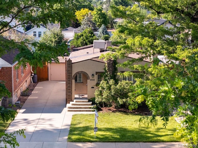 3739 W 46th Ave, Denver, CO 80211 - view of front of property with driveway, stucco siding, and a front yard