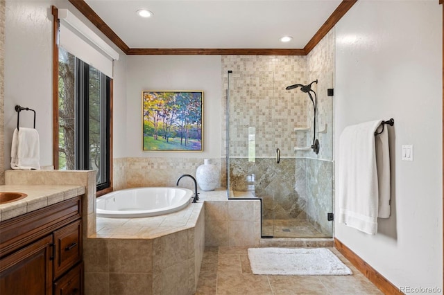 bathroom with ornamental molding, a stall shower, a garden tub, vanity, and recessed lighting