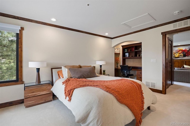 bedroom with a desk, attic access, carpet, ornamental molding, and baseboards