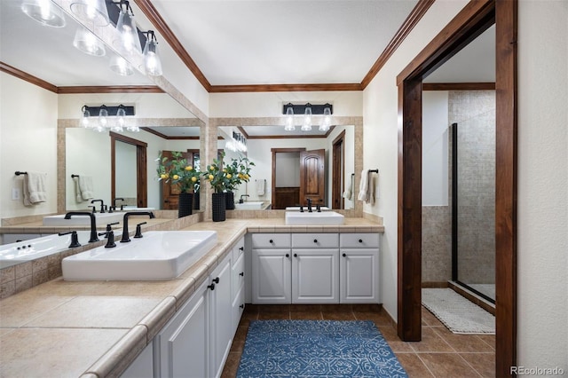 full bath featuring tile patterned floors, crown molding, double vanity, and a shower with shower door