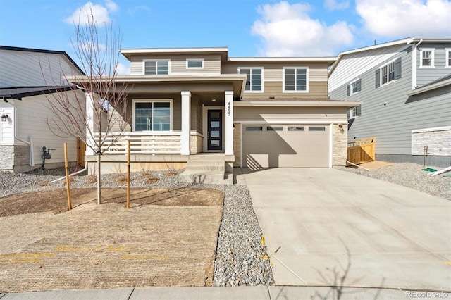 view of front of house with an attached garage, a porch, and driveway