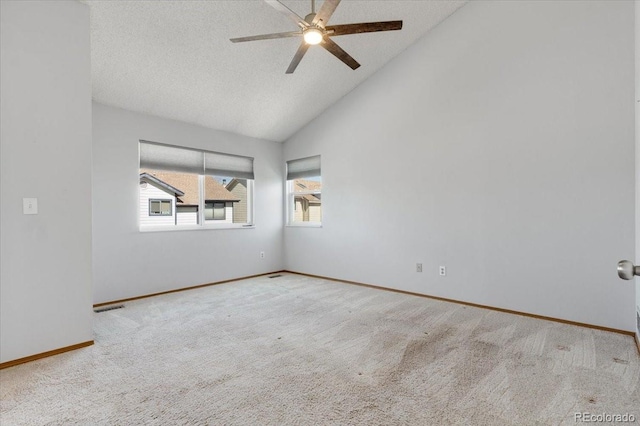 carpeted empty room featuring visible vents, high vaulted ceiling, a textured ceiling, baseboards, and ceiling fan