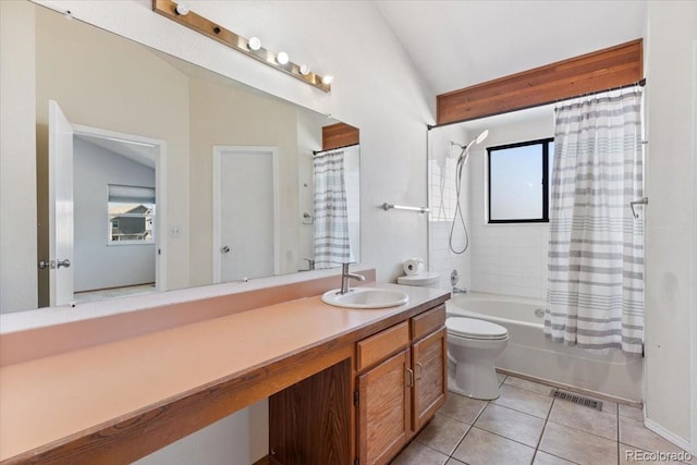 full bath with tile patterned floors, visible vents, plenty of natural light, and vaulted ceiling