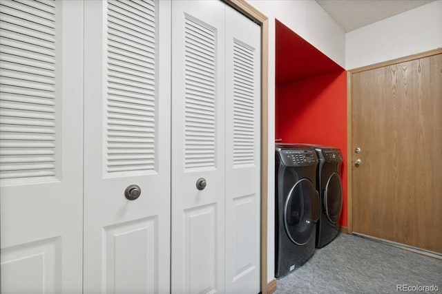 washroom featuring carpet and washing machine and clothes dryer