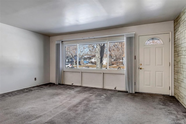 entrance foyer featuring carpet flooring