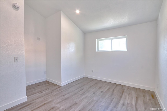 spare room with light hardwood / wood-style floors