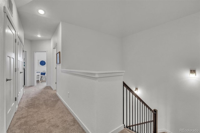 5714 Villa Lorenzo Dr, Colorado Springs, CO 80919 - corridor with an upstairs landing, recessed lighting, light carpet, and baseboards