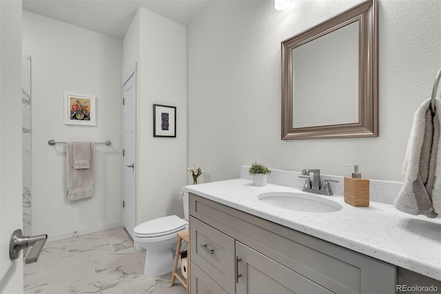 5714 Villa Lorenzo Dr, Colorado Springs, CO 80919 - bathroom featuring marble finish floors, vanity, and toilet