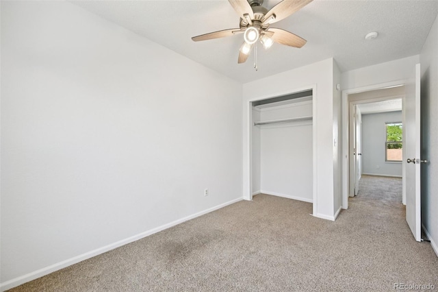 920 44th Avenue Ct Unit 30, Greeley, CO 80634 - unfurnished bedroom featuring light carpet, a closet, and a ceiling fan