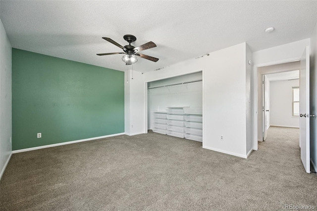 920 44th Avenue Ct Unit 30, Greeley, CO 80634 - unfurnished bedroom with carpet floors, a textured ceiling, a closet, and ceiling fan