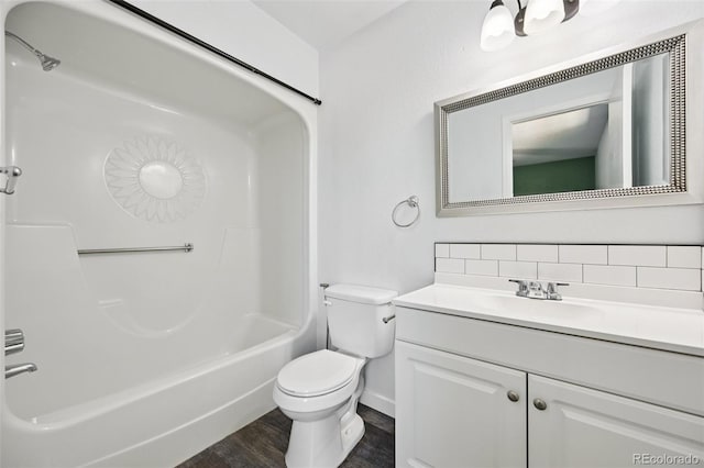 920 44th Avenue Ct Unit 30, Greeley, CO 80634 - full bath featuring vanity, wood finished floors, decorative backsplash, and tub / shower combination
