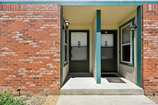 920 44th Avenue Ct Unit 30, Greeley, CO 80634 - view of exterior entry featuring brick siding