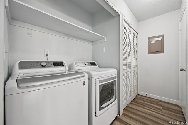 920 44th Avenue Ct Unit 30, Greeley, CO 80634 - laundry room with washing machine and clothes dryer, wood finished floors, electric panel, and a textured ceiling