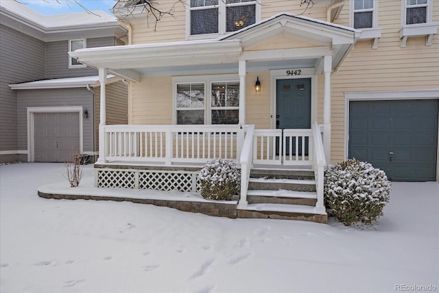 view of front of house with covered porch and a garage