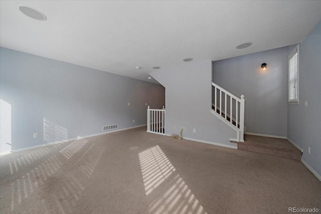 unfurnished living room with carpet floors