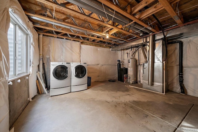 basement featuring separate washer and dryer, water heater, heating unit, and a healthy amount of sunlight