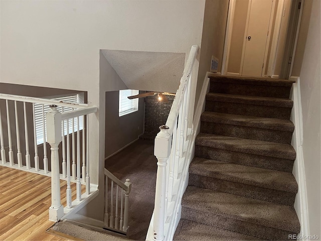 staircase featuring hardwood / wood-style flooring