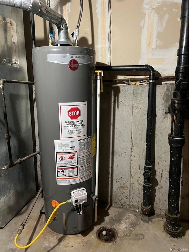 utility room featuring water heater