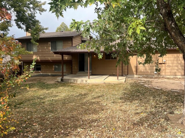 back of property featuring a patio