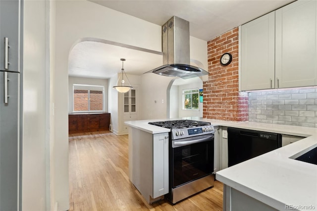 521 Harrison St, Denver, CO 80206 - kitchen with island range hood, gas range, dishwasher, and arched walkways