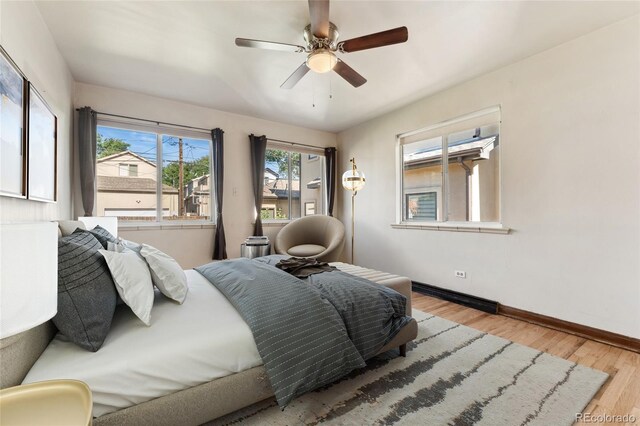 521 Harrison St, Denver, CO 80206 - bedroom with wood finished floors and ceiling fan