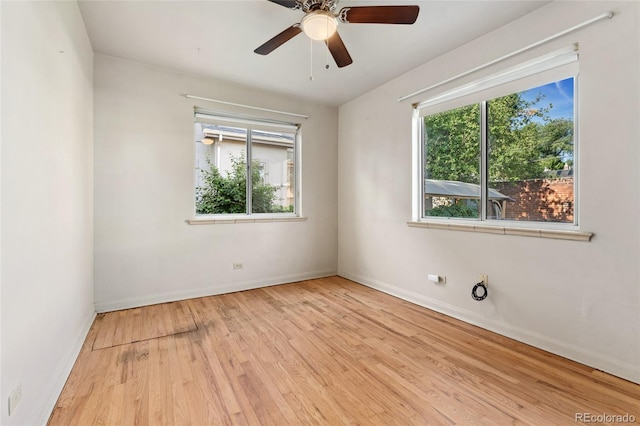521 Harrison St, Denver, CO 80206 - spare room featuring wood finished floors and a ceiling fan