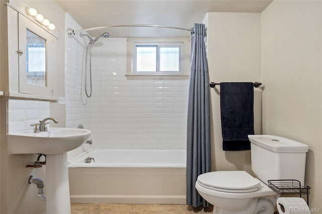 521 Harrison St, Denver, CO 80206 - bathroom with shower / bath combination with curtain and tile patterned flooring