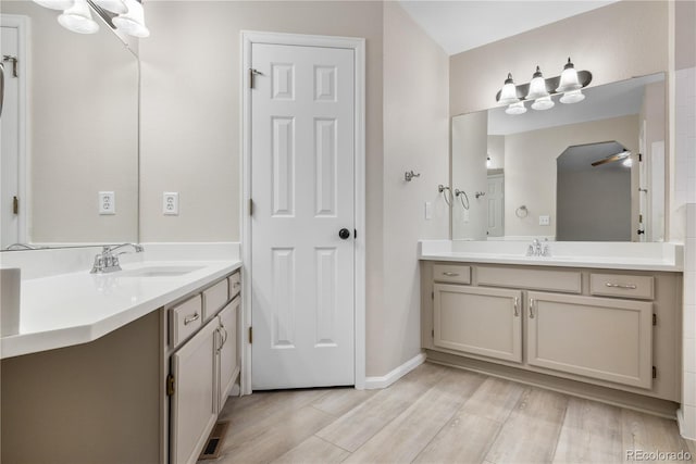 bathroom with hardwood / wood-style flooring and vanity