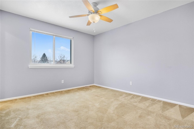 empty room featuring carpet flooring and ceiling fan