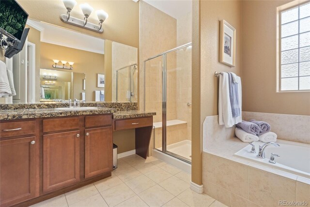 10182 Bristleridge St, Parker, CO 80134 - bathroom with vanity, a shower stall, a garden tub, and tile patterned floors
