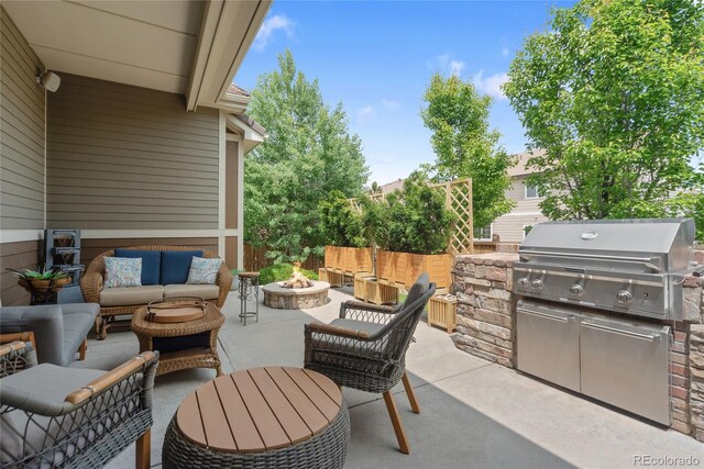 10182 Bristleridge St, Parker, CO 80134 - view of patio with an outdoor living space with a fire pit