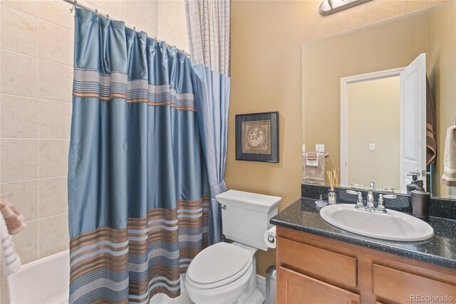 10182 Bristleridge St, Parker, CO 80134 - bathroom featuring toilet, vanity, and shower / bath combo with shower curtain