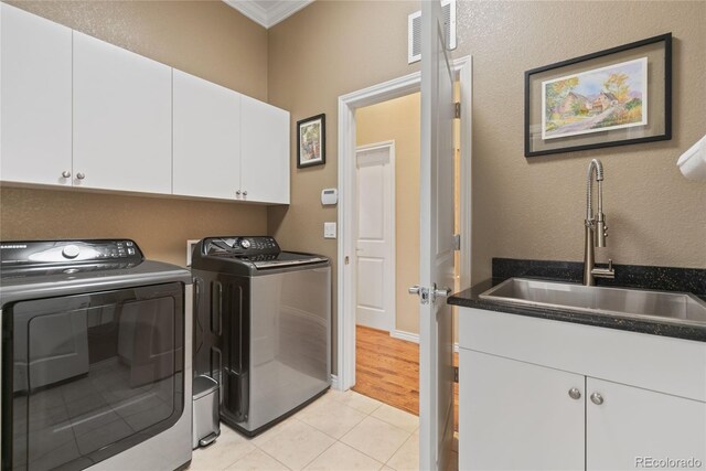 10182 Bristleridge St, Parker, CO 80134 - laundry area with cabinet space, independent washer and dryer, crown molding, and light tile patterned floors