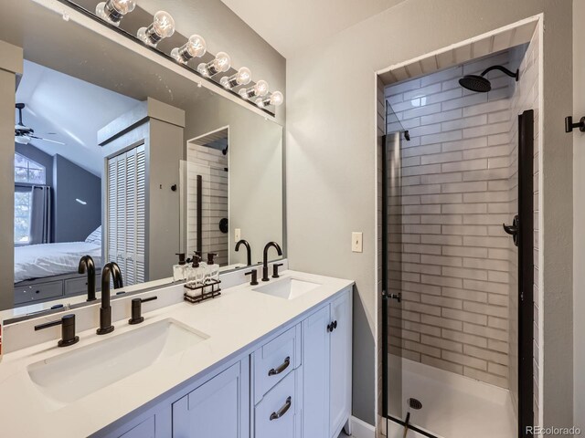 bathroom with walk in shower, vanity, and ceiling fan