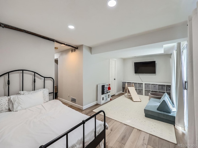 bedroom with light wood-type flooring