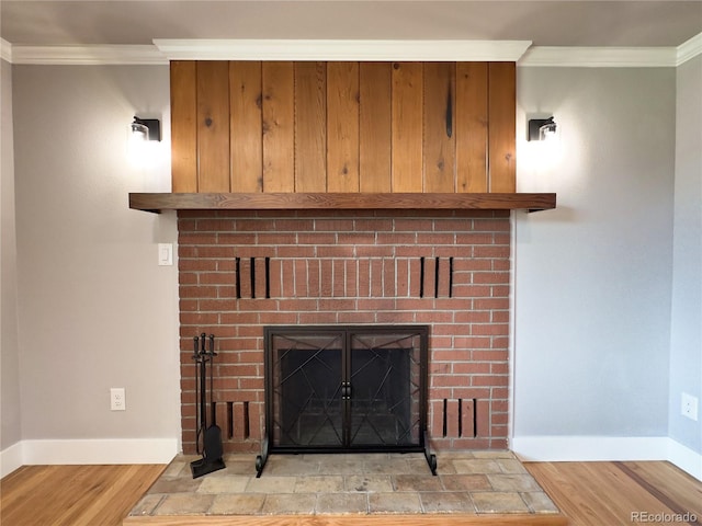 10025 W 8th Ave, Lakewood, CO 80215 - detailed view of wood finished floors, crown molding, a brick fireplace, and baseboards