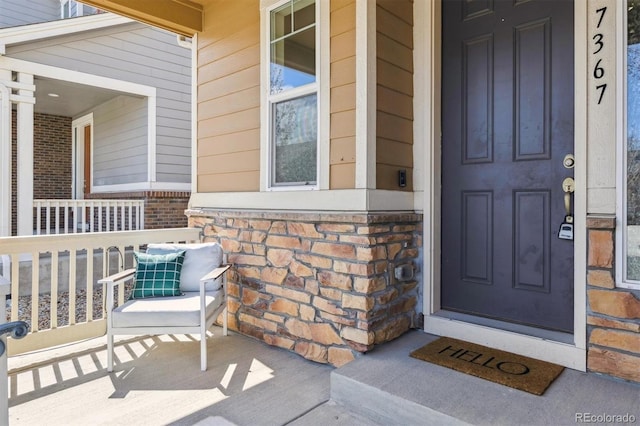 7367 S Pennsylvania St, Littleton, CO 80122 - property entrance with covered porch and brick siding