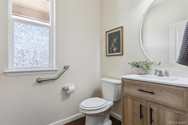 7367 S Pennsylvania St, Littleton, CO 80122 - half bath with toilet, vanity, and baseboards