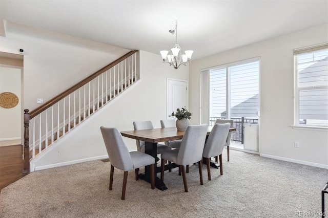 7367 S Pennsylvania St, Littleton, CO 80122 - carpeted dining space featuring stairway, a chandelier, healthy amount of natural light, and baseboards