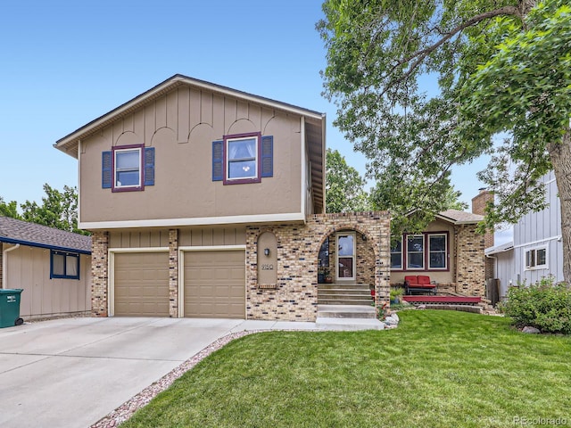 9150 Garrison St, Broomfield, CO 80021 - view of front of home featuring a front lawn, concrete driveway, an attached garage, brick siding, and board and batten siding
