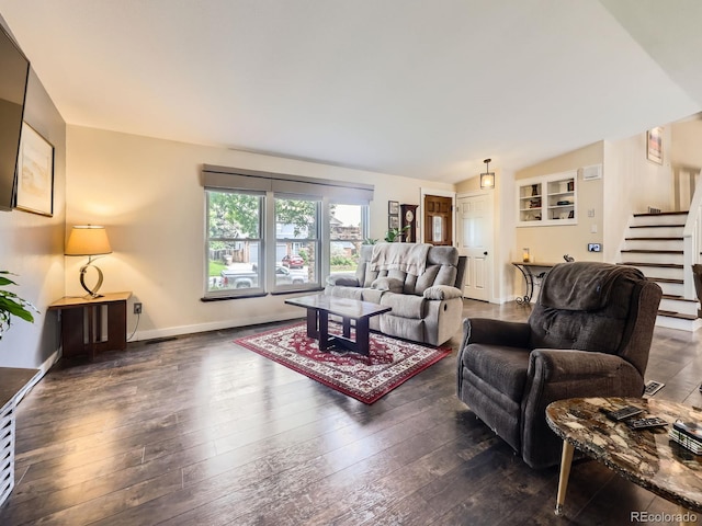 9150 Garrison St, Broomfield, CO 80021 - living room with stairway, dark wood finished floors, lofted ceiling, and baseboards