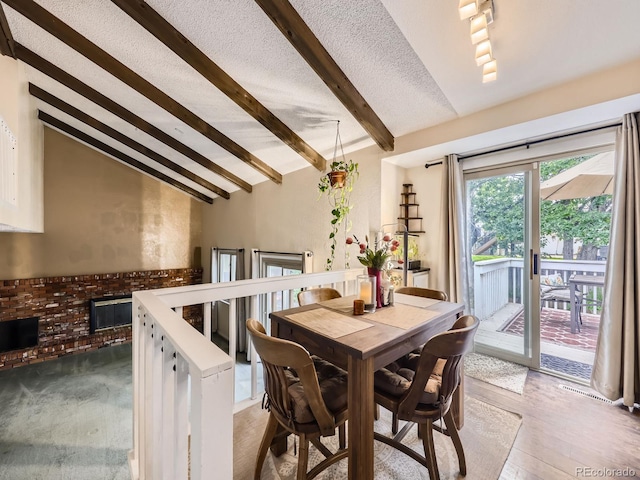 9150 Garrison St, Broomfield, CO 80021 - dining area with a brick fireplace