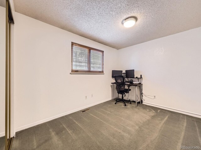 9150 Garrison St, Broomfield, CO 80021 - office space featuring a textured ceiling, baseboards, and carpet flooring