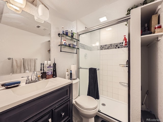 9150 Garrison St, Broomfield, CO 80021 - full bathroom with toilet, a stall shower, vanity, and a textured wall