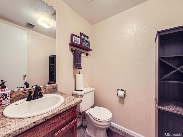 9150 Garrison St, Broomfield, CO 80021 - half bath featuring vanity, toilet, and baseboards