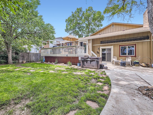 9150 Garrison St, Broomfield, CO 80021 - back of house with a hot tub, a deck, and a patio