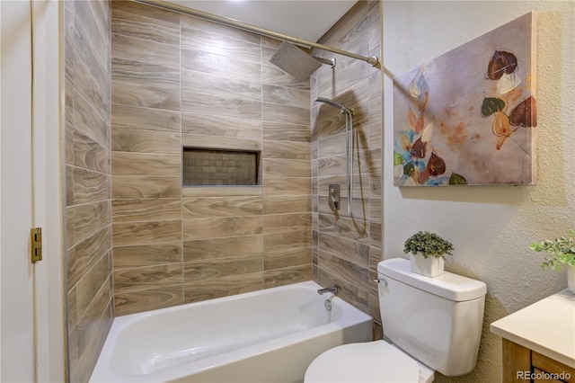 full bathroom with vanity, toilet, and tiled shower / bath combo