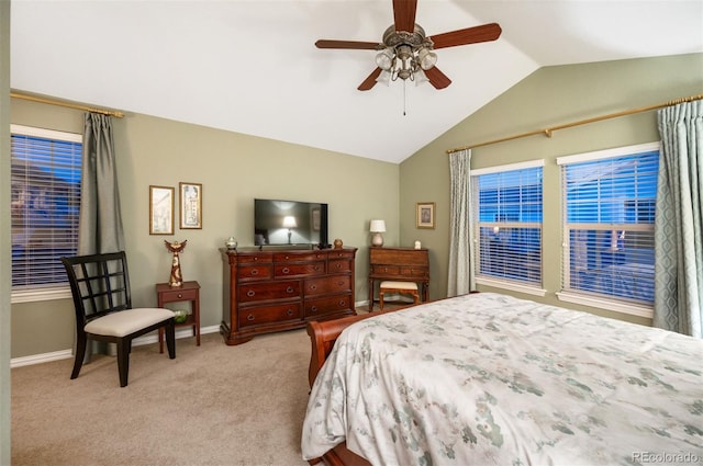 bedroom with ceiling fan, lofted ceiling, and light carpet