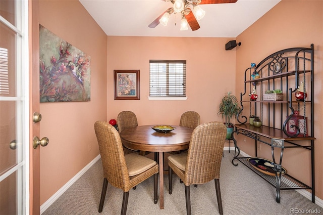 dining room featuring carpet and ceiling fan